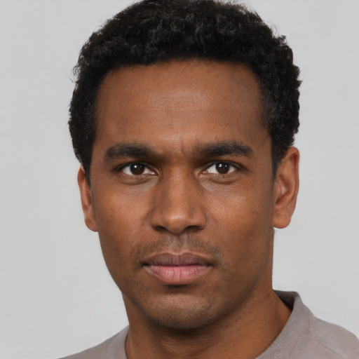 Neutral black young-adult male with short  black hair and brown eyes
