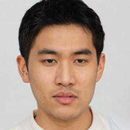 Neutral asian young-adult male with short  brown hair and brown eyes