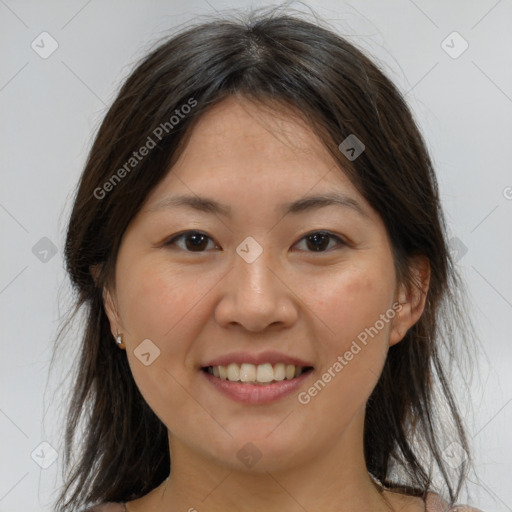 Joyful white young-adult female with medium  brown hair and brown eyes