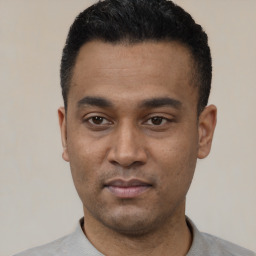 Neutral latino young-adult male with short  black hair and brown eyes