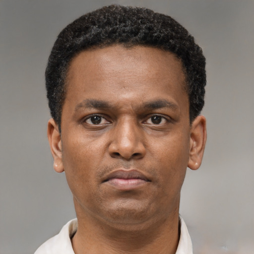 Neutral black adult male with short  brown hair and brown eyes