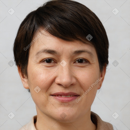 Joyful white adult female with short  brown hair and brown eyes