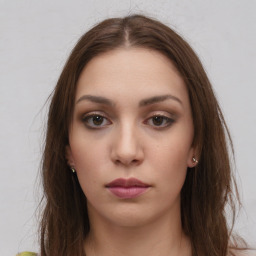 Neutral white young-adult female with long  brown hair and brown eyes