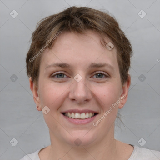 Joyful white young-adult female with short  brown hair and grey eyes