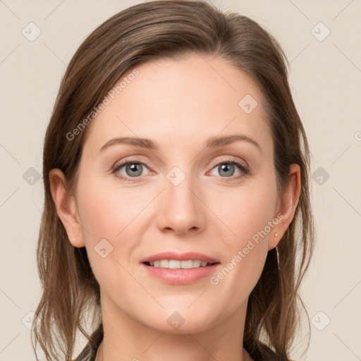 Joyful white young-adult female with long  brown hair and grey eyes