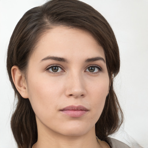 Neutral white young-adult female with medium  brown hair and brown eyes