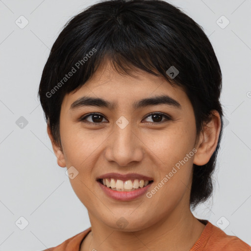 Joyful asian young-adult female with short  brown hair and brown eyes