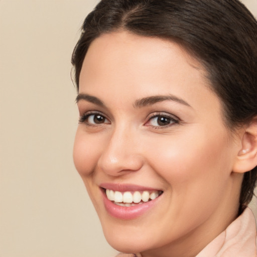 Joyful white young-adult female with medium  brown hair and brown eyes