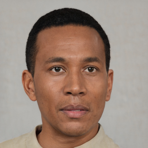 Neutral black young-adult male with short  black hair and brown eyes