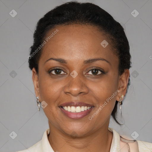 Joyful black adult female with short  brown hair and brown eyes