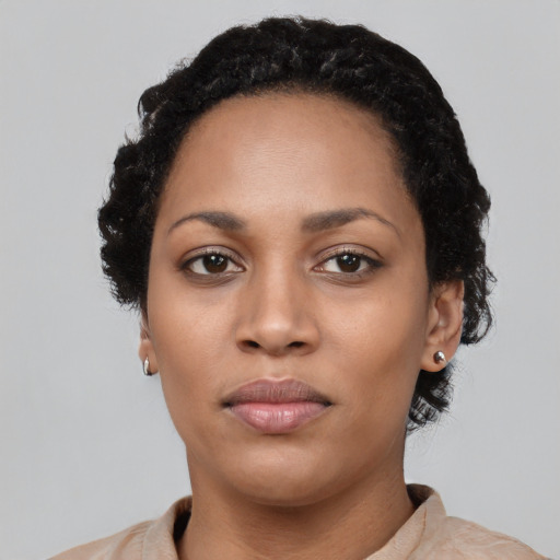 Neutral latino young-adult female with short  black hair and brown eyes