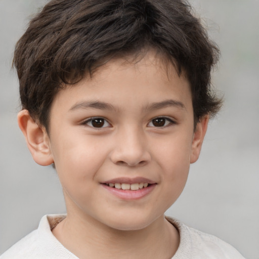 Joyful white child male with short  brown hair and brown eyes