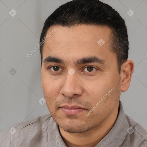 Joyful white young-adult male with short  black hair and brown eyes