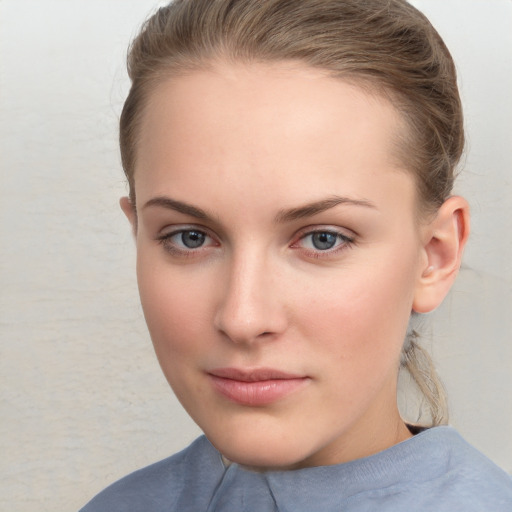 Neutral white young-adult female with medium  brown hair and grey eyes