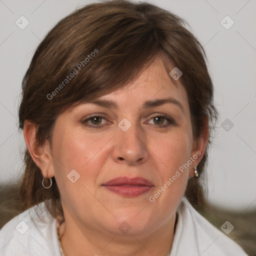 Joyful white adult female with medium  brown hair and grey eyes