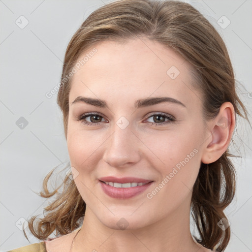 Joyful white young-adult female with medium  brown hair and blue eyes