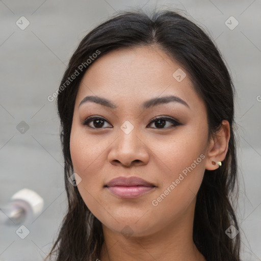 Joyful asian young-adult female with long  brown hair and brown eyes