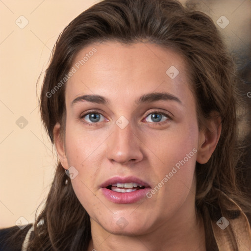 Joyful white young-adult female with long  brown hair and grey eyes