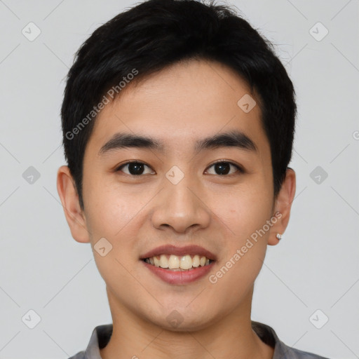 Joyful asian young-adult male with short  black hair and brown eyes