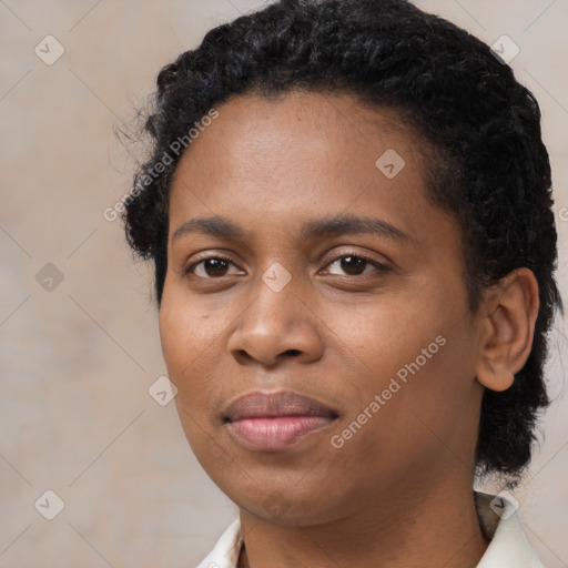 Joyful black young-adult female with medium  black hair and brown eyes