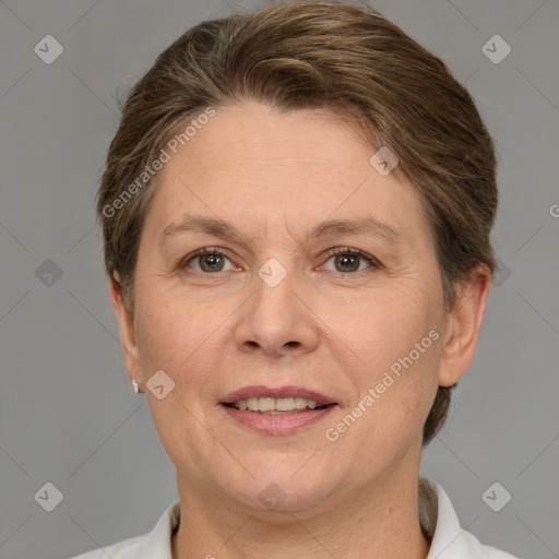 Joyful white adult female with short  brown hair and grey eyes