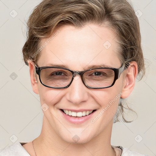 Joyful white adult female with short  brown hair and blue eyes