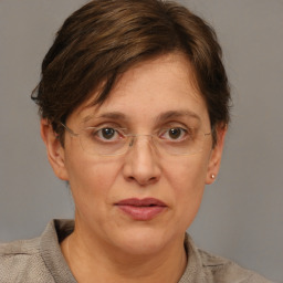 Joyful white adult female with short  brown hair and grey eyes