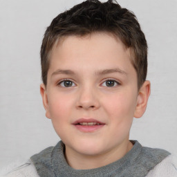 Joyful white child male with short  brown hair and brown eyes