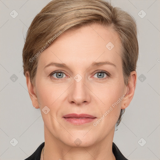 Joyful white adult female with short  brown hair and grey eyes