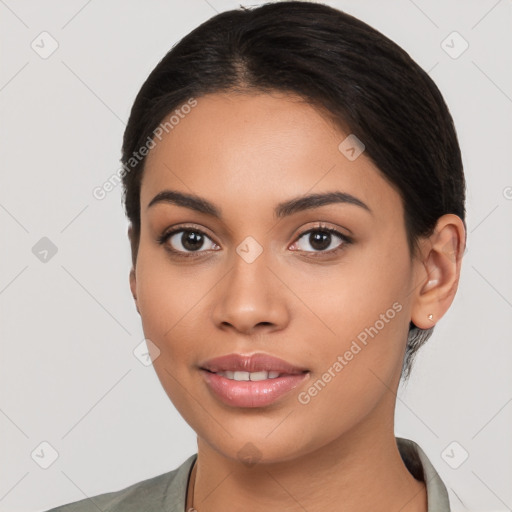 Joyful latino young-adult female with medium  black hair and brown eyes