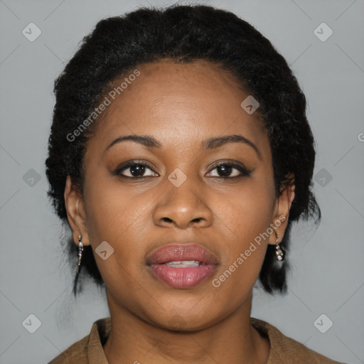 Joyful black young-adult female with medium  black hair and brown eyes