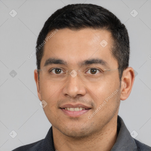 Joyful white young-adult male with short  black hair and brown eyes