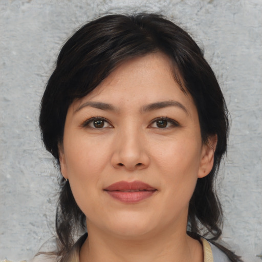 Joyful asian young-adult female with medium  black hair and brown eyes