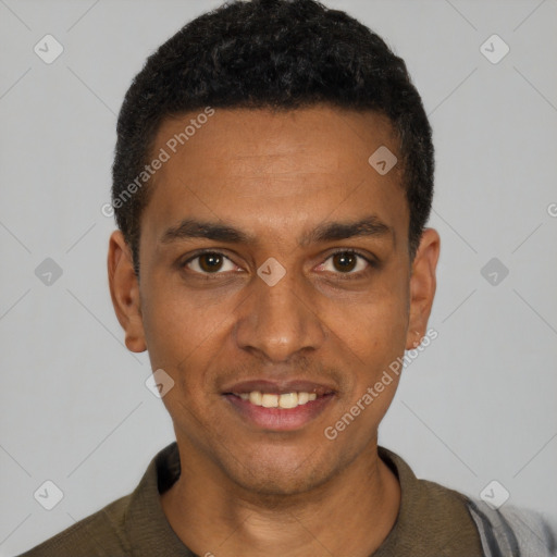 Joyful black young-adult male with short  black hair and brown eyes