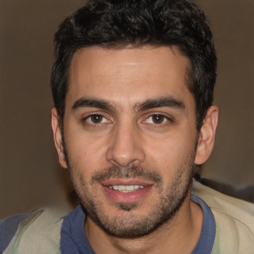 Joyful white young-adult male with short  black hair and brown eyes