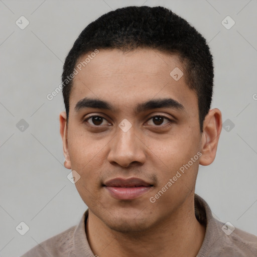 Joyful latino young-adult male with short  black hair and brown eyes