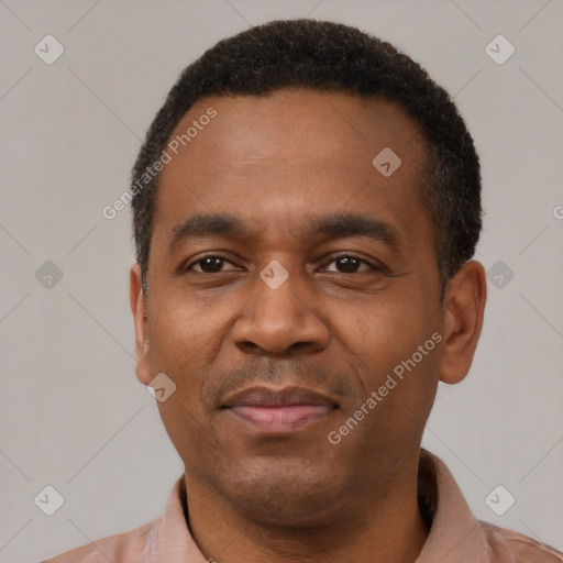 Joyful latino adult male with short  black hair and brown eyes