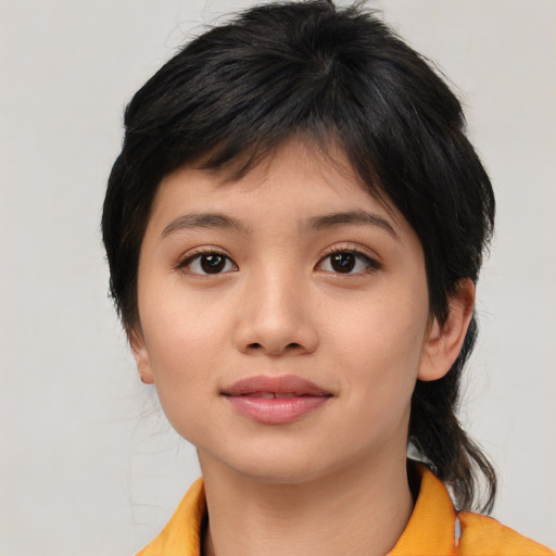 Joyful asian young-adult female with medium  black hair and brown eyes