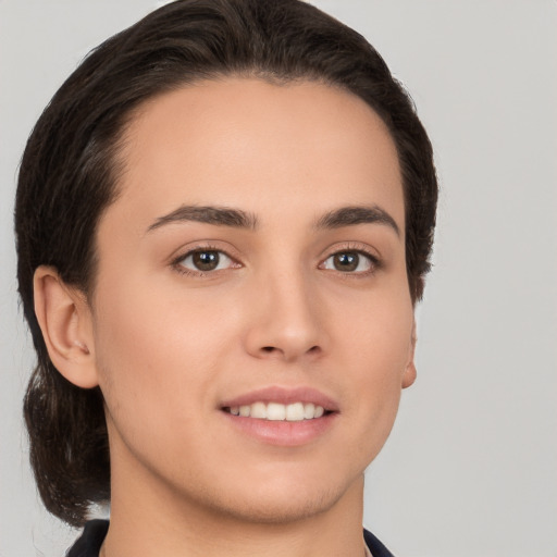 Joyful white young-adult female with medium  brown hair and brown eyes