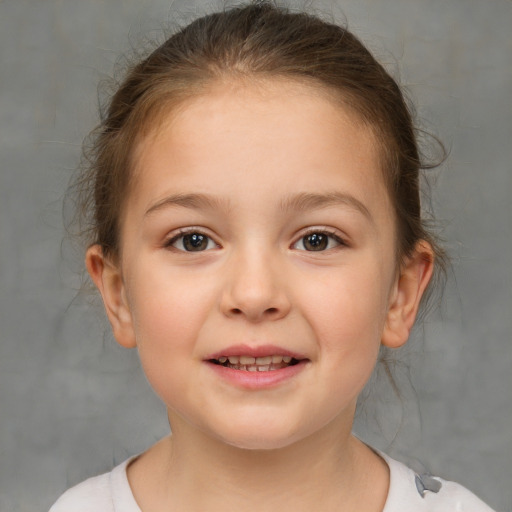 Joyful white child female with medium  brown hair and brown eyes