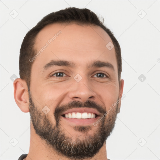 Joyful white young-adult male with short  brown hair and brown eyes