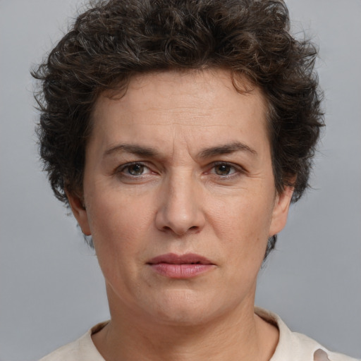 Joyful white adult female with short  brown hair and brown eyes