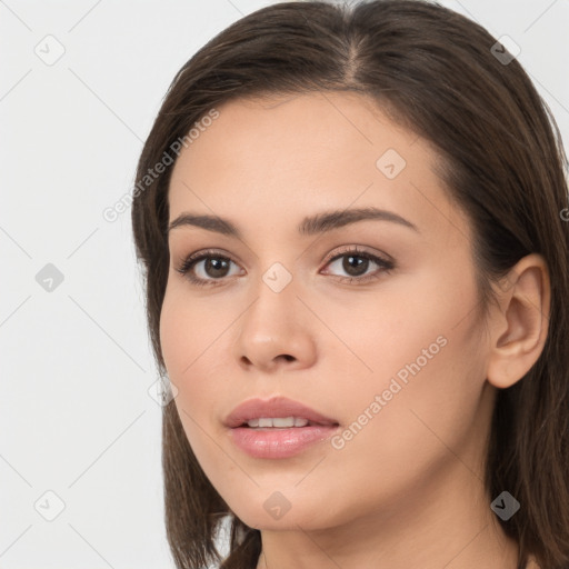 Neutral white young-adult female with long  brown hair and brown eyes