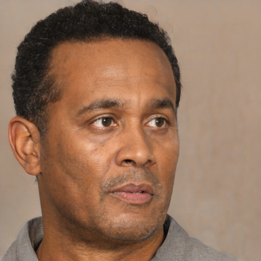 Neutral black adult male with short  brown hair and brown eyes
