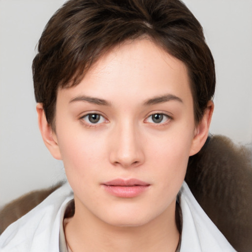 Neutral white young-adult female with short  brown hair and brown eyes