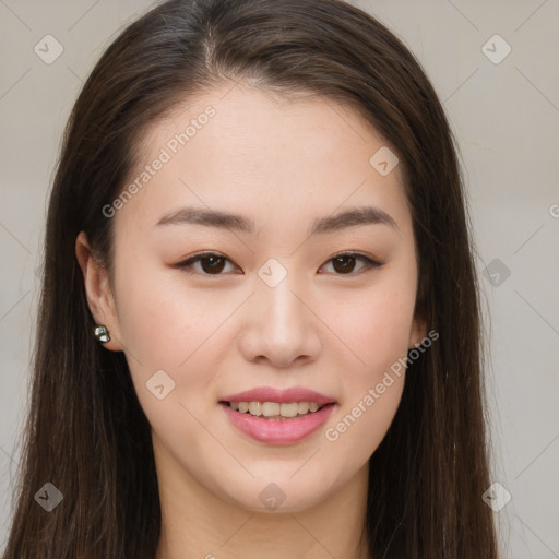 Joyful asian young-adult female with long  brown hair and brown eyes