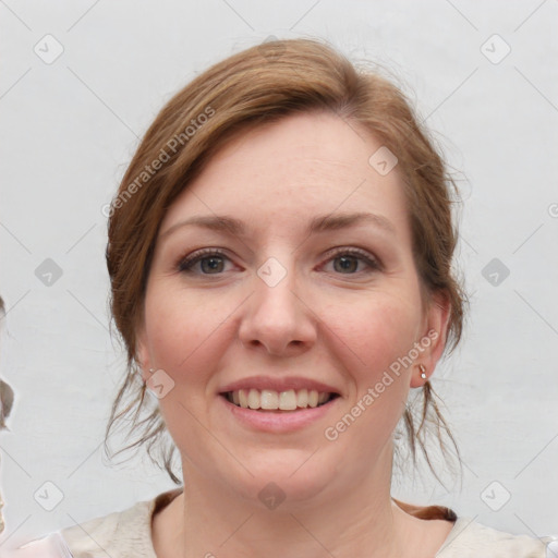 Joyful white young-adult female with medium  brown hair and blue eyes