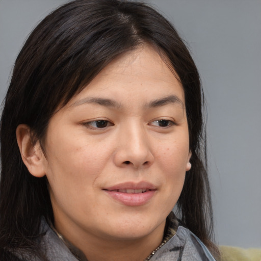 Joyful asian young-adult female with medium  brown hair and brown eyes