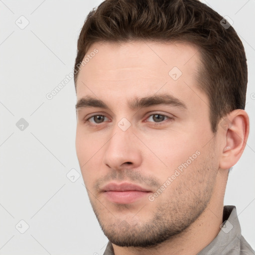 Neutral white young-adult male with short  brown hair and brown eyes