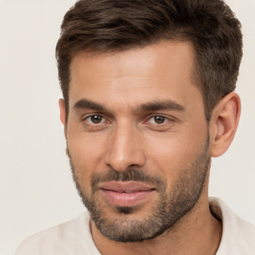 Joyful white young-adult male with short  brown hair and brown eyes